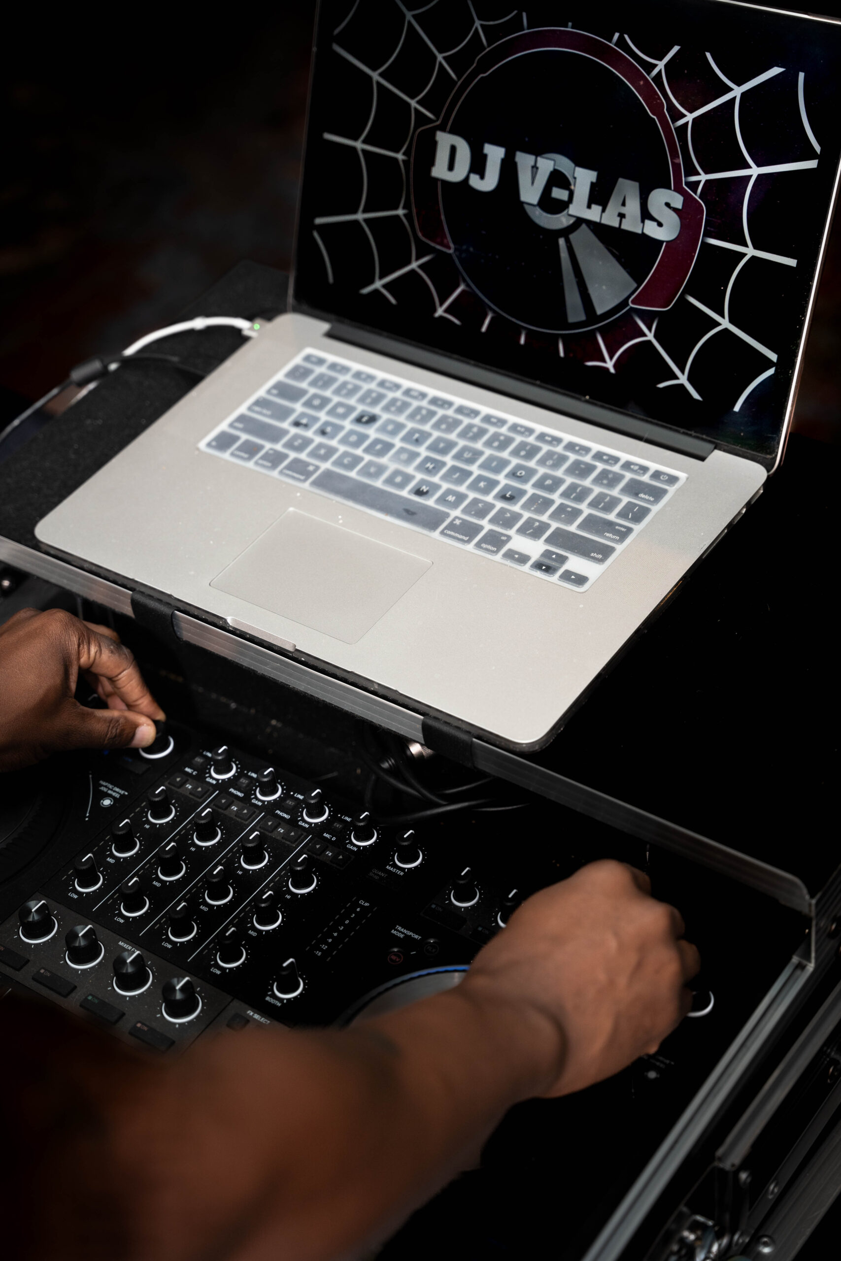 A look down onto the rig of a DJ as he works the knobs for Personal Brand Photos For Business